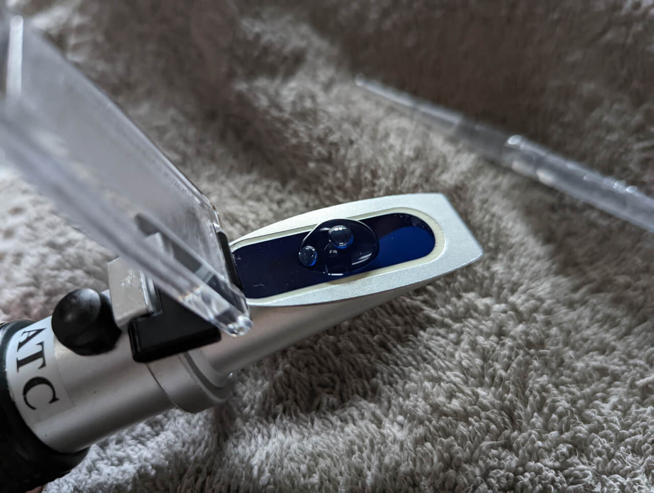 Refractometer with water sample on prism Refractometer with water sample on prism